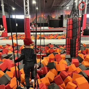 a young boy on a trampoline