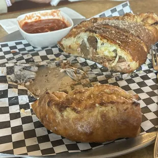 Huge Calzone, And it&apos;s almost half gone!