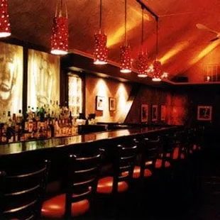 the interior of a dimly lit bar