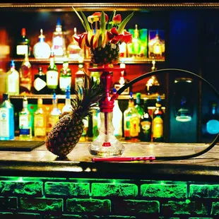 a pineapple on a bar counter