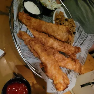 a plate of fried fish sticks and coleslaw
