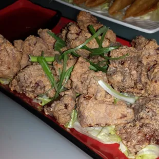 Chicken karaage bites: tender chicken morsels lightly battered and fried (served with sweet chili &amp; ginger sauce) $8