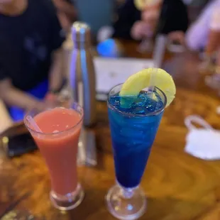 two cocktails on a table