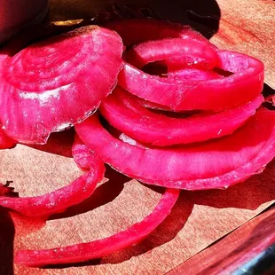 sliced onions on a cutting board