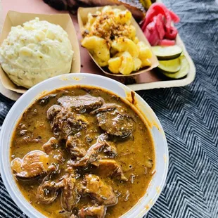 a bowl of beef and potatoes