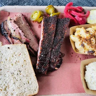 a tray of meat and sides