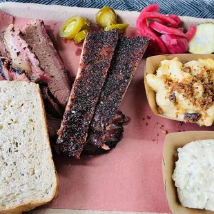 a tray of meat and macaroni and cheese