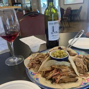 a plate of food and a glass of wine