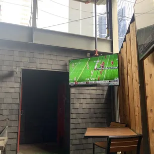 Outdoor patio with TVs and overhead cover