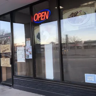 the open sign in the window