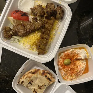 Beef Soltani with Rice, few pieces of pita, and Labneh.