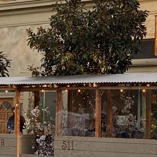 the outside of a restaurant with a awning