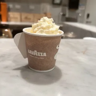 espresso con panna cream in togo cup. cool design (handle)