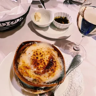 a plate of food and a glass of wine