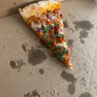 Last piece of Tandoori pizza before I eat it. lol