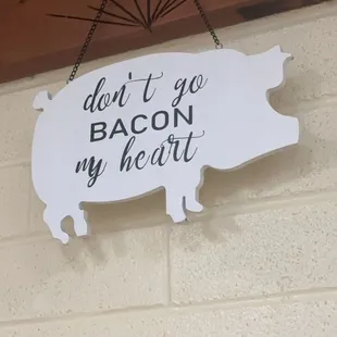 a sign saying don&apos;t go bacon my heart