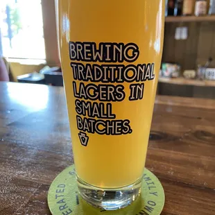 a glass of beer on a table
