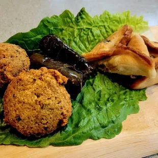 Falafel, grape leaves, and spinach pie