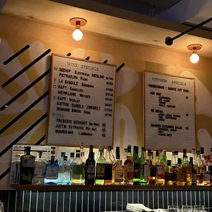 menus on the wall of a bar
