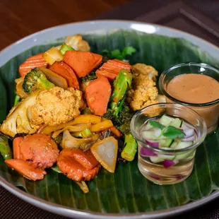 Vegie Satay with peanut sauce and cucumber salad
