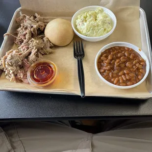 Pulled pork plate with BBQ beans, potato salad, and HOT sauce.