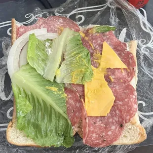 Horrible sandwich made with what looks like leftovers.
