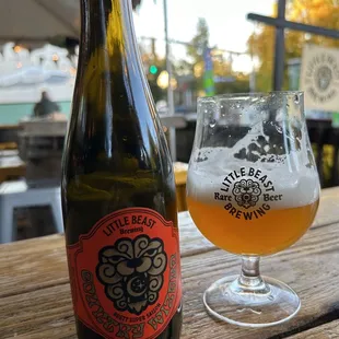 a bottle and a glass of beer