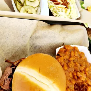 a pulled pork sandwich and baked beans