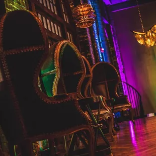 a row of chairs in a dimly lit room