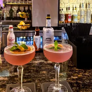 two cocktails on a bar