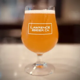 a glass of beer on a table