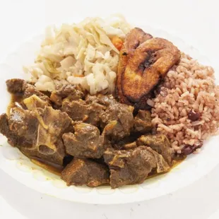Slowly, Braised, cooked Goat, marinated in the finest Curry from Jamaica.