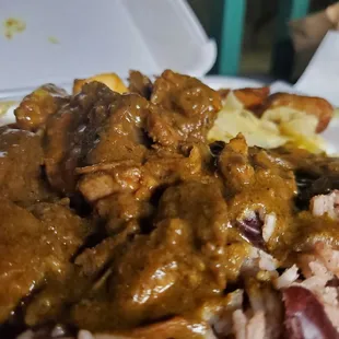 Curry goat combo plate
