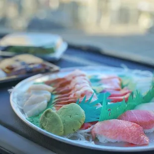 a plate of sushi on the dashboard of a car