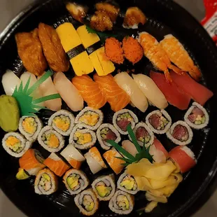 Party tray A with lobster roll maki, rainbow roll maki, and unagi and masago sushi