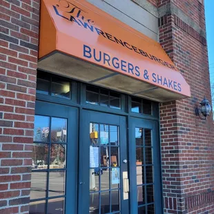 the entrance to burgers and shakes