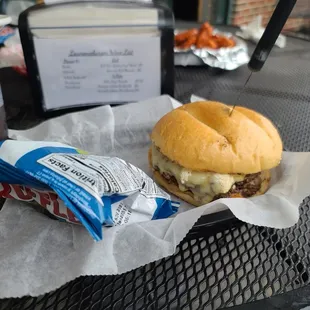 a sandwich and a drink on a table