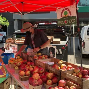 a man selling apples