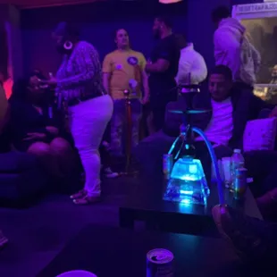a group of people in a dark room
