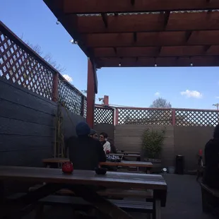 Partially covered back smoking patio.