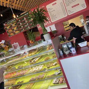 a woman standing in front of the counter
