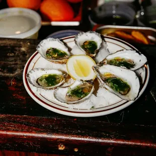 a plate of oysters on a table
