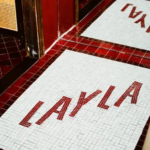 a red and white tiled floor and a red and white tiled floor