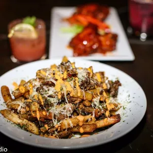 a plate of fries and a drink