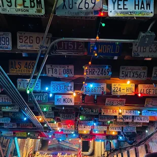 many license plates hanging from the ceiling