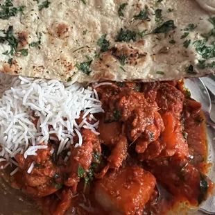 Chicken vindaloo and garlic naan.