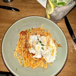 a plate of spaghetti with meat and sauce