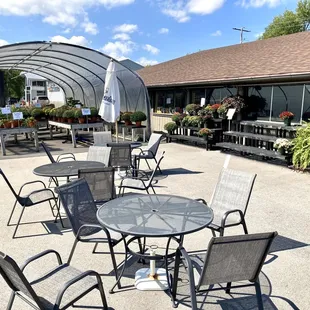 patio area with tables and chairs