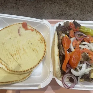 Super supreme comes with 3 pitas plenty of meat the take away box is packed here