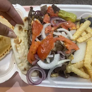 Super supreme gyro enough for 3 people comes with soup, tzatziki sauce, fixings, and fries or rice. Very good